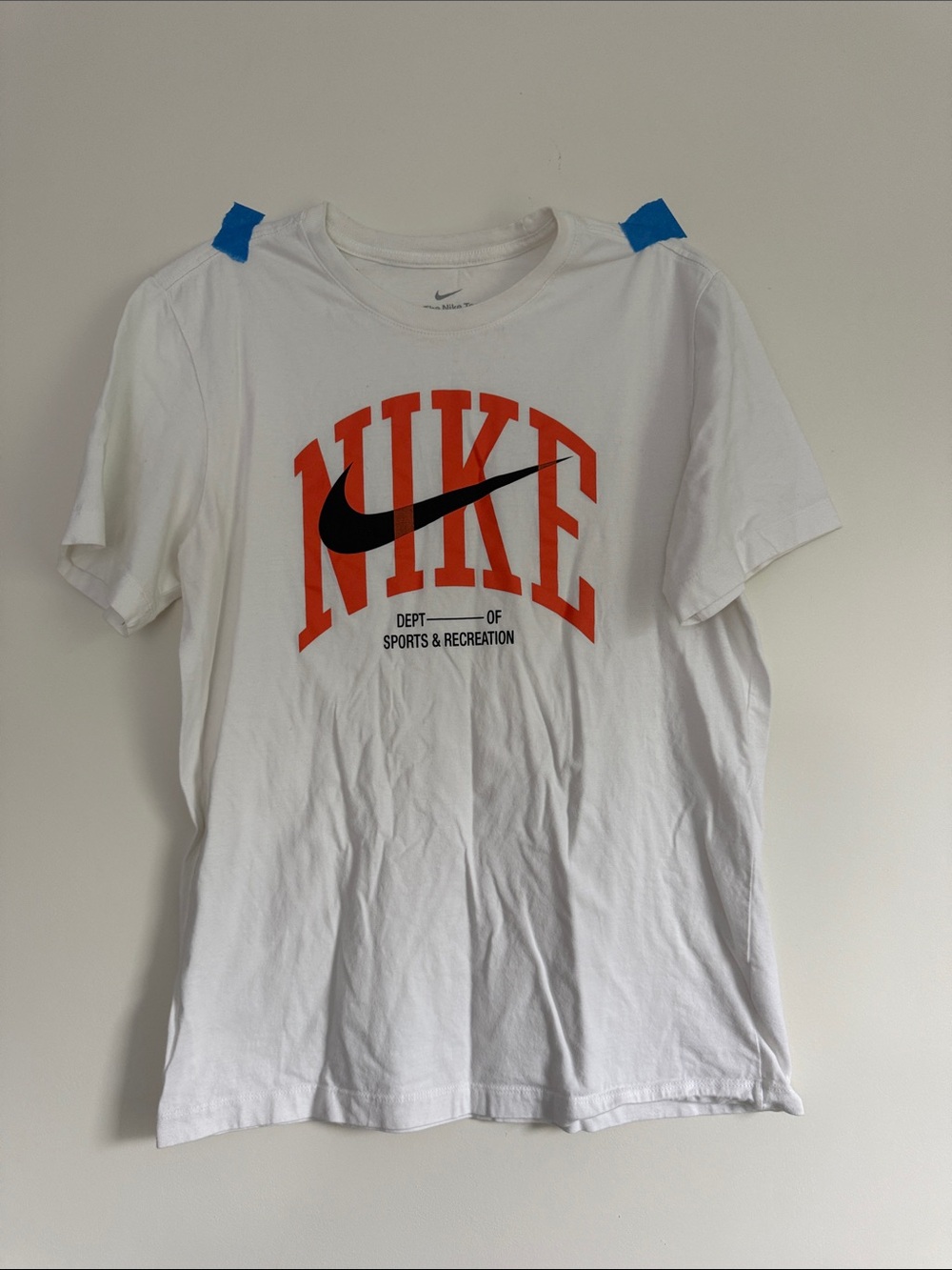 The Nike Tee - White Short-Sleeve Tee Orange Graphic and Black Swoosh Medium